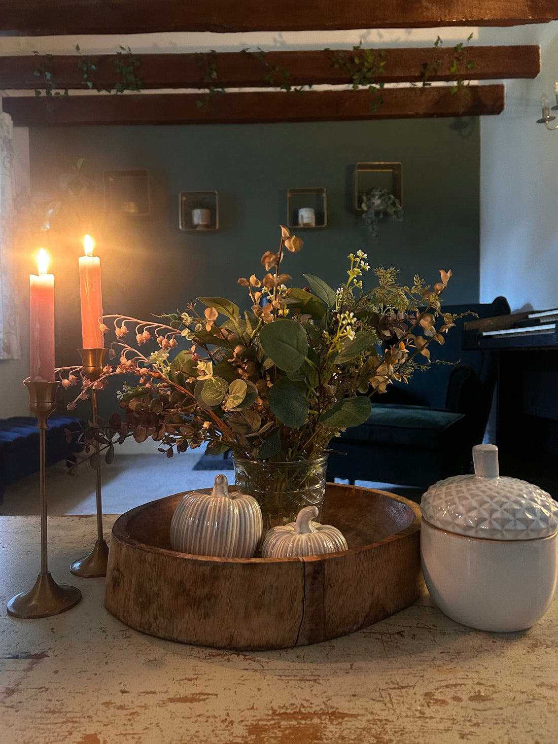 Living room candlit in a barn with Autumn decor 