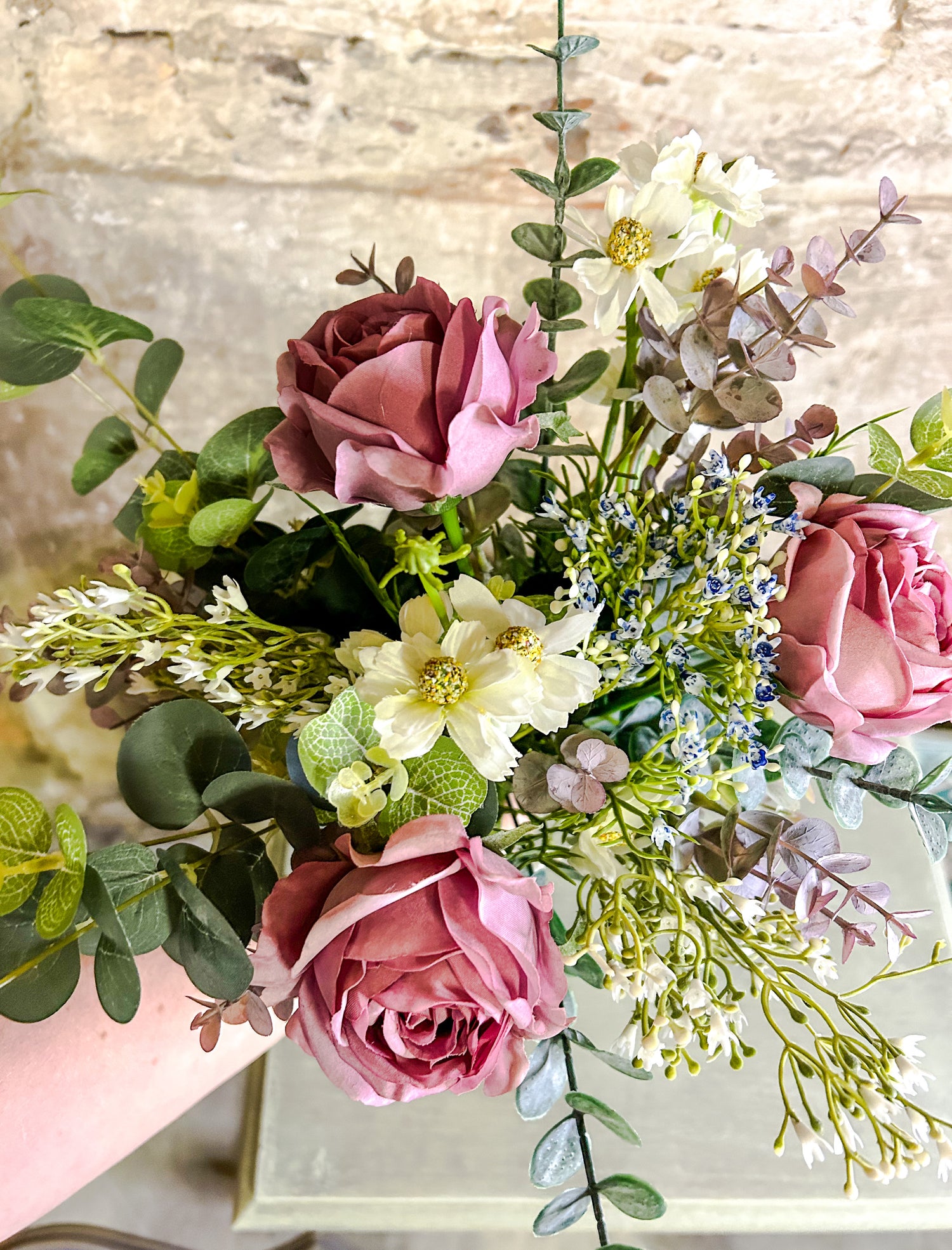 Pink Faux Flower bunch being held 